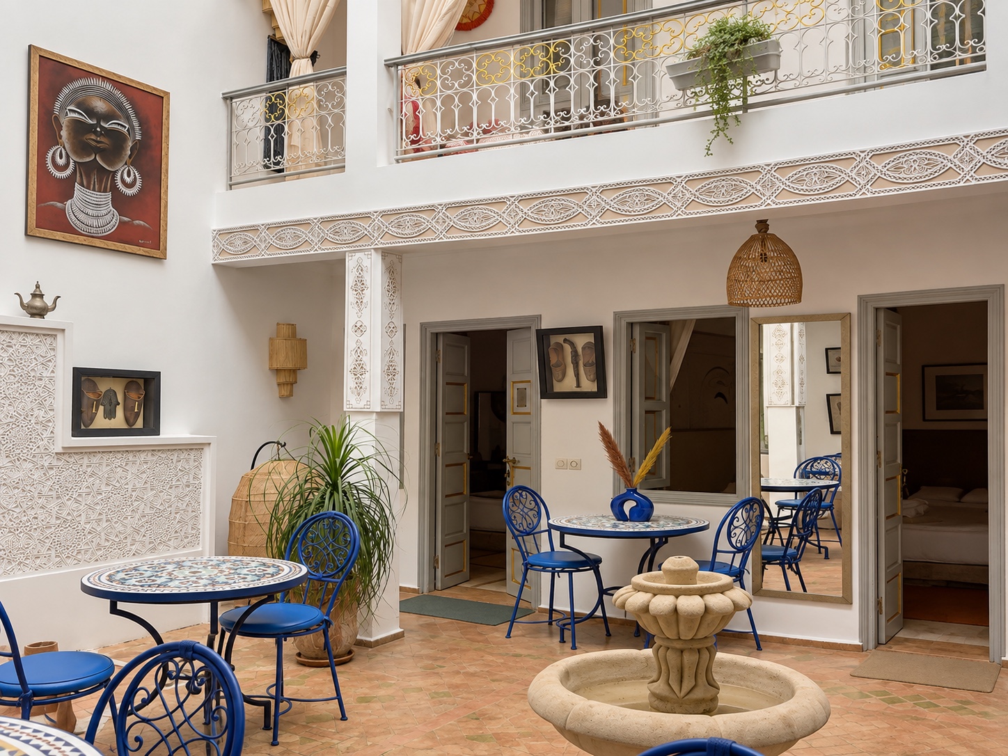 Dar Chadia’s courtyard, fountain and blue furniture